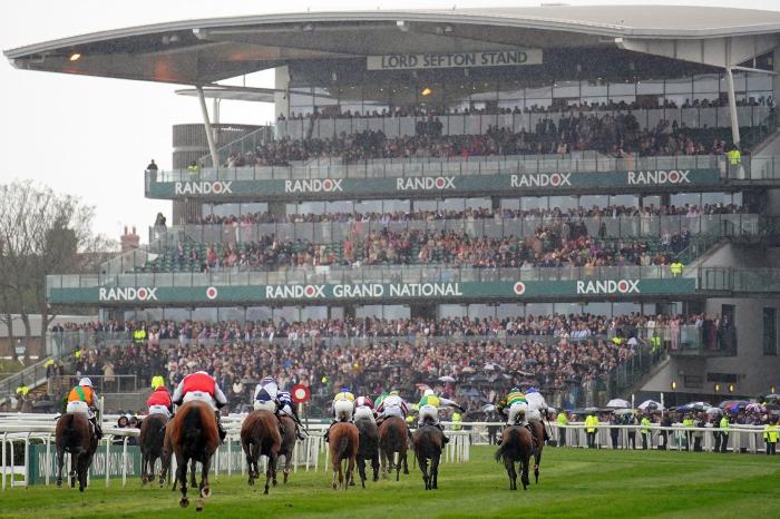 Runners and riders pass the grandstand in the William Hill Handicap Hurdle during day two of the Randox Grand National Festival at Aintree Racecourse, Liverpool. Picture date: Friday April 14, 2023.