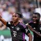 Munich's Mathys Tel (L) celebrates with Munich's Dayot Upamecano
