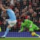 Erling Haaland of Manchester City (C) scores