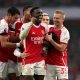 Arsenal's Takehiro Tomiyasu celebrates scoring his sides fifth goal with Eddie Nketiah and Oleksandr Zinchenko