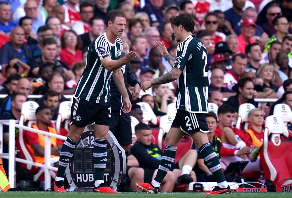 Manchester United's Jonny Evans (left) comes on for the substituted Victor Lindelo