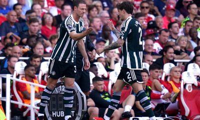 Manchester United's Jonny Evans (left) comes on for the substituted Victor Lindelo