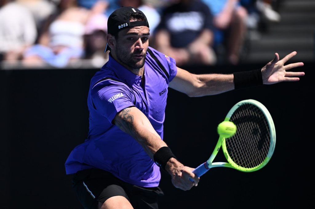 epa11822643 Matteo Berrettini of Italy in action against Cameron Norrie of Great Britain during the Men's Singles first round match at the Australian Open tennis tournament in Melbourne, Australia, 14 January 2025. EPA/JOEL CARRETT AUSTRALIA AND NEW ZEALAND OUT