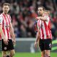 Jordan Henderson and Nathan Collins of Brentford