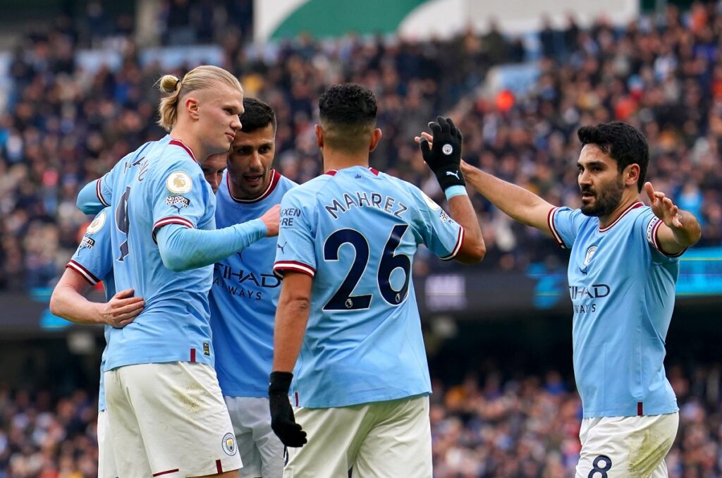 Manchester City's Erling Haaland celebrates with his team-mates after scoring their side's first goal of the game during the Premier League match at the Etihad Stadium, Manchester. Picture date: Sunday January 22, 2023.