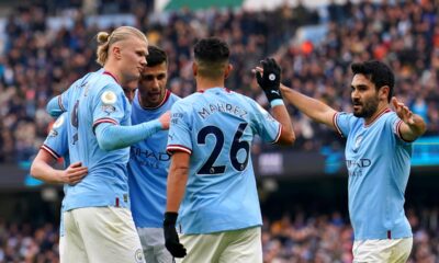 Manchester City's Erling Haaland celebrates with his team-mates after scoring their side's first goal of the game during the Premier League match at the Etihad Stadium, Manchester. Picture date: Sunday January 22, 2023.