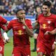 epa10287850 Leipzig's Christopher Nkunku (2-L) celebrates with teammates after scoring the 1-0 lead during the German Bundesliga soccer match between TSG 1899 Hoffenheim and RB Leipzig in Sinsheim, Germany, 05 November 2022. EPA/RONALD WITTEK CONDITIONS - ATTENTION: The DFL regulations prohibit any use of photographs as image sequences and/or quasi-video.