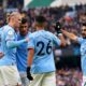 Manchester City's Erling Haaland celebrates with his team-mates after scoring their side's first goal of the game during the Premier League match at the Etihad Stadium, Manchester. Picture date: Sunday January 22, 2023.