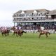 Runners and riders in action as they compete in the Remus Uomo Handicap Hurdle during the Coral Scottish Grand National Ladies Day at Ayr Racecourse, Ayr. Picture date: Friday April 1, 2022.