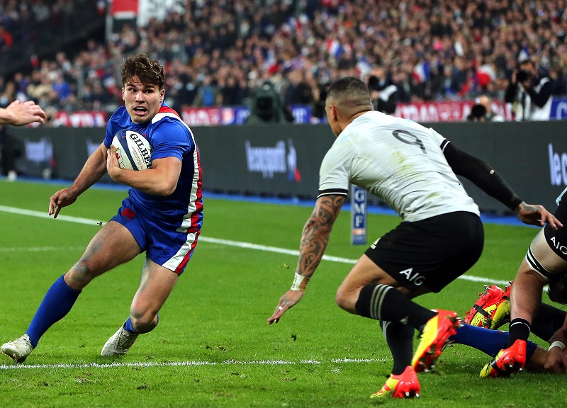 Antoine Dupont of France in action against Aaron Smith of New Zealand