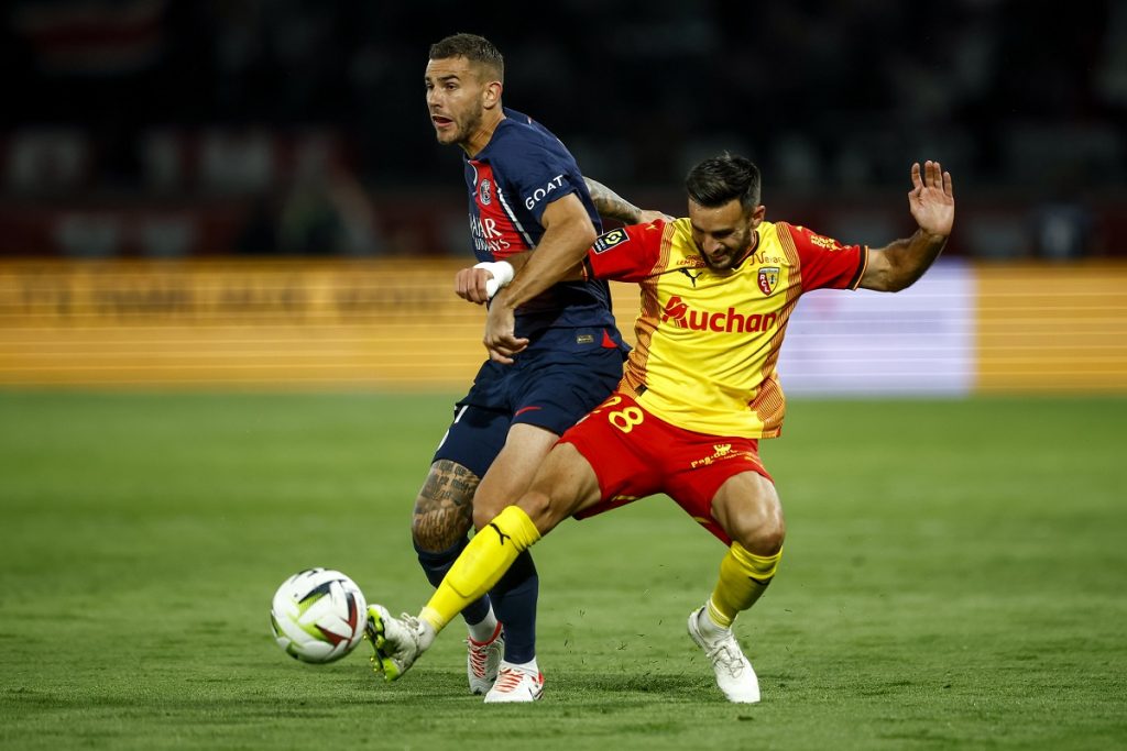 Lucas Hernandez of PSG (L) in action against Adrien Thomasson of Lens