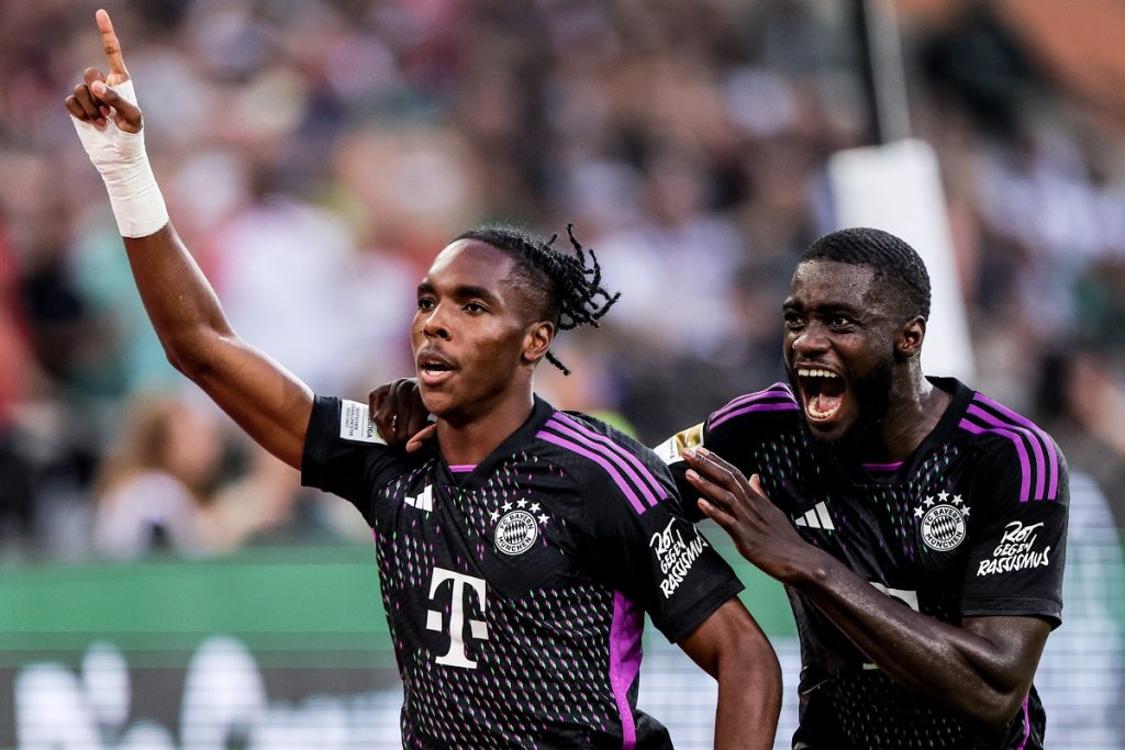 Munich's Mathys Tel (L) celebrates with Munich's Dayot Upamecano