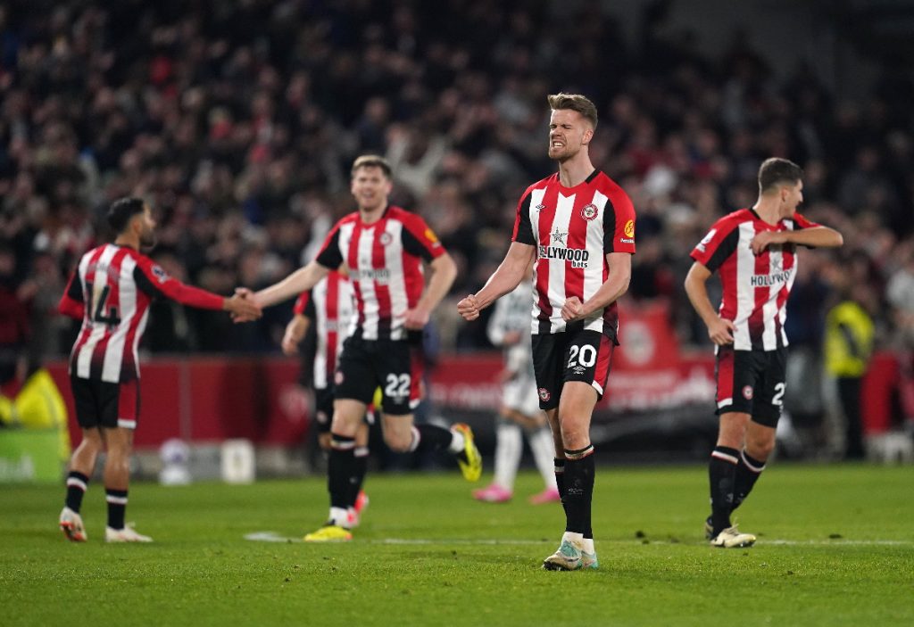 Brentford players celebrate after scoring against Manchester United