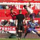 Ethan Pinnock of Brentford scores against Manchester United