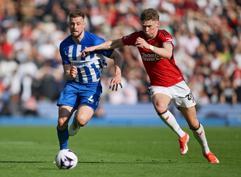 epa11353487 Brighton's Adam Webster (L) and Manchester United's Scott McTominay battle for the ball during the English Premier League soccer match of Brighton & Hove Albion against Manchester United, in Brighton, Britain, 19 May 2024. EPA/DANIEL HAMBURY EDITORIAL USE ONLY. No use with unauthorized audio, video, data, fixture lists, club/league logos, 'live' services or NFTs. Online in-match use limited to 120 images, no video emulation. No use in betting, games or single club/