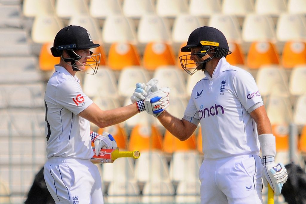 epa11651874 England's Joe Root (R) and Harry Brook (L) shake hands during the fourth day of the first Test between Pakistan and England at Multan Cricket Stadium in Multan, Pakistan, 10 October 2024. EPA/FAISAL KAREEM