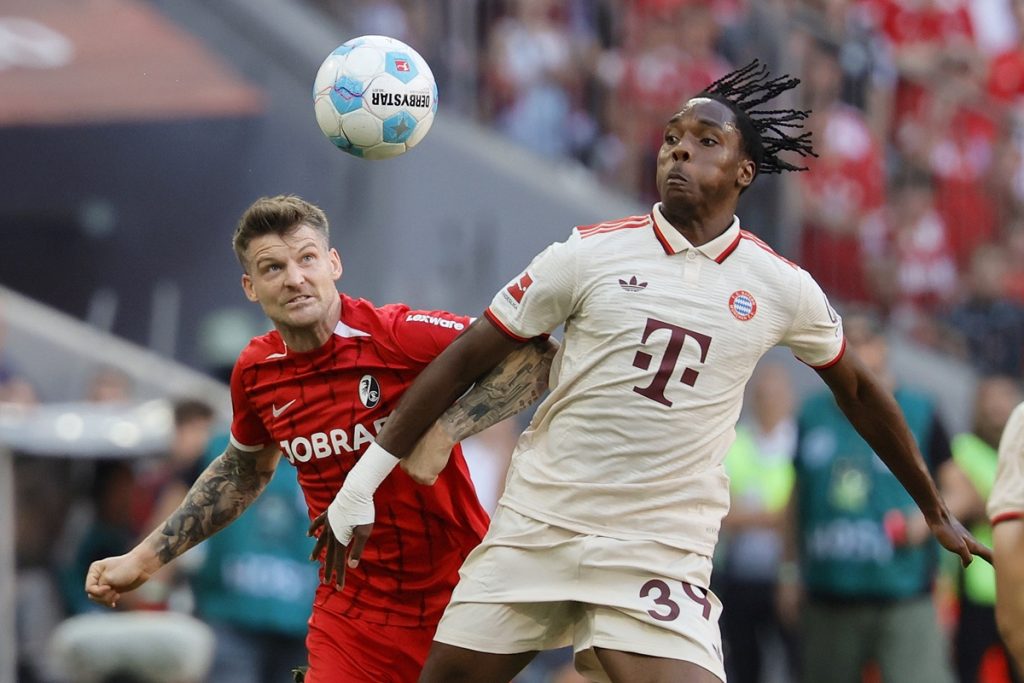 epa11577884 Mathys Tel of Munich (R) in action against Lukas Kuebler of Freiburg (L) during the German Bundesliga soccer match between FC Bayern Munich and SC Freiburg, in Munich, Germany, 01 September 2024. EPA/RONALD WITTEK CONDITIONS - ATTENTION: The DFL regulations prohibit any use of photographs as image sequences and/or quasi-video.