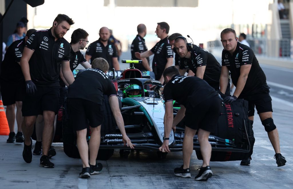 epa11767711 Mechanics push the car of Mercedes' young driver Frederik Vesti of Denmark during the Formula One post-season test session at the Yas Marina Circuit racetrack in Abu Dhabi, United Arab Emirates,