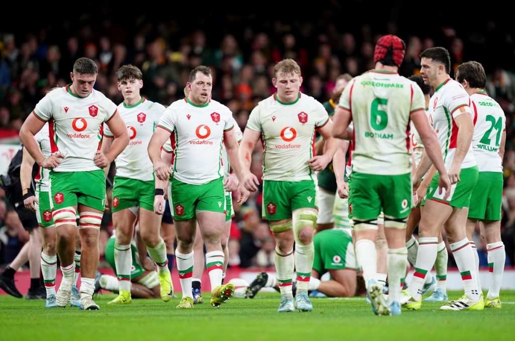 Wales' players show their dejection after conceding a try during the Autumn International match at the Principality Stadium, Cardiff. Picture date: Saturday November 23, 2024.