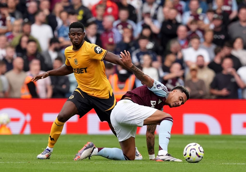 Wolverhampton Wanderers' Yerson Mosquera and Aston Villa's Morgan Rogers battle for the ball during the Premier League match at Villa Park, Birmingham.