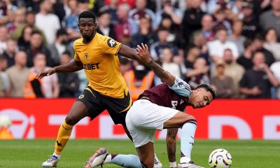 Wolverhampton Wanderers' Yerson Mosquera and Aston Villa's Morgan Rogers battle for the ball during the Premier League match at Villa Park, Birmingham.