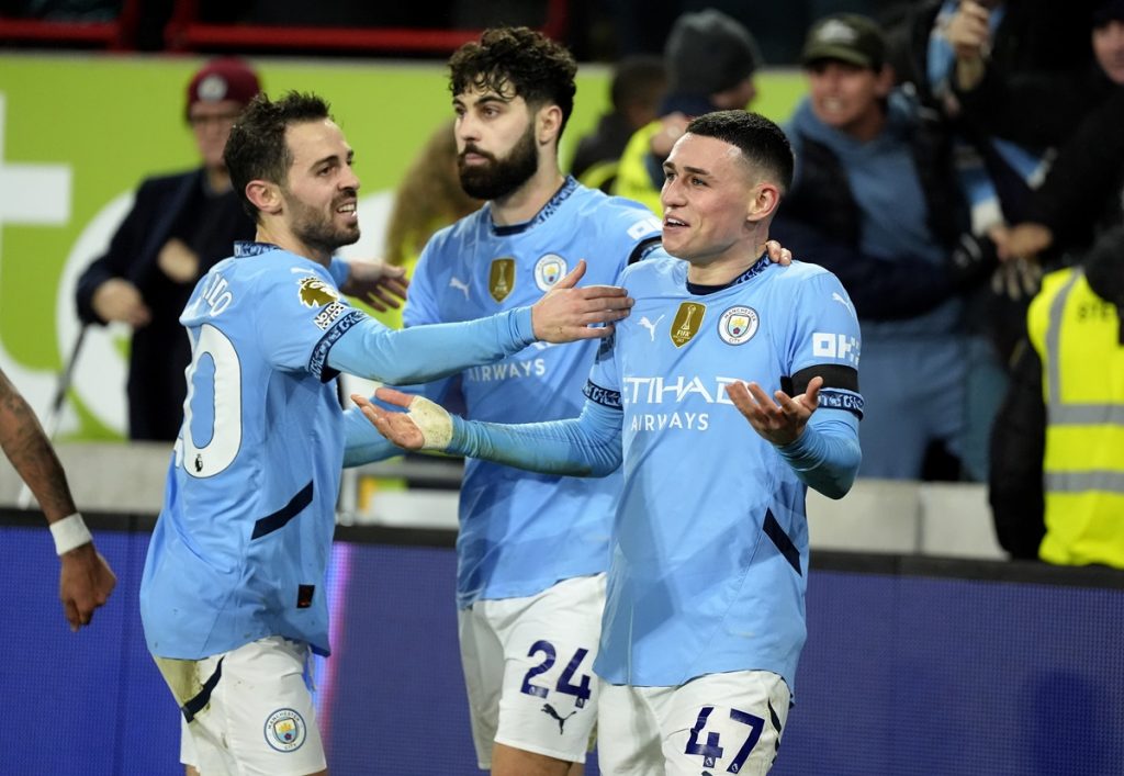 Manchester City's Phil Foden celebrates scoring their side's second goal of the game during the Premier League match at the Gtech Community Stadium, London