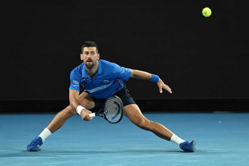 epa11835777 Novak Djokovic of Serbia plays a shot during the Men's Singles round four match against Jiri Lehecka of the Czech Republic at the Australian Open tennis tournament in Melbourne, Australia, 19 January 2025. EPA/JAMES ROSS AUSTRALIA AND NEW ZEALAND OUT