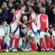 Arsenal's Myles Lewis-Skelly (centre right) is replaced by substitute Arsenal's Riccardo Calafiori (left) during the Premier League match at the Emirates Stadium, London. Picture date: Sunday February 2, 2025.