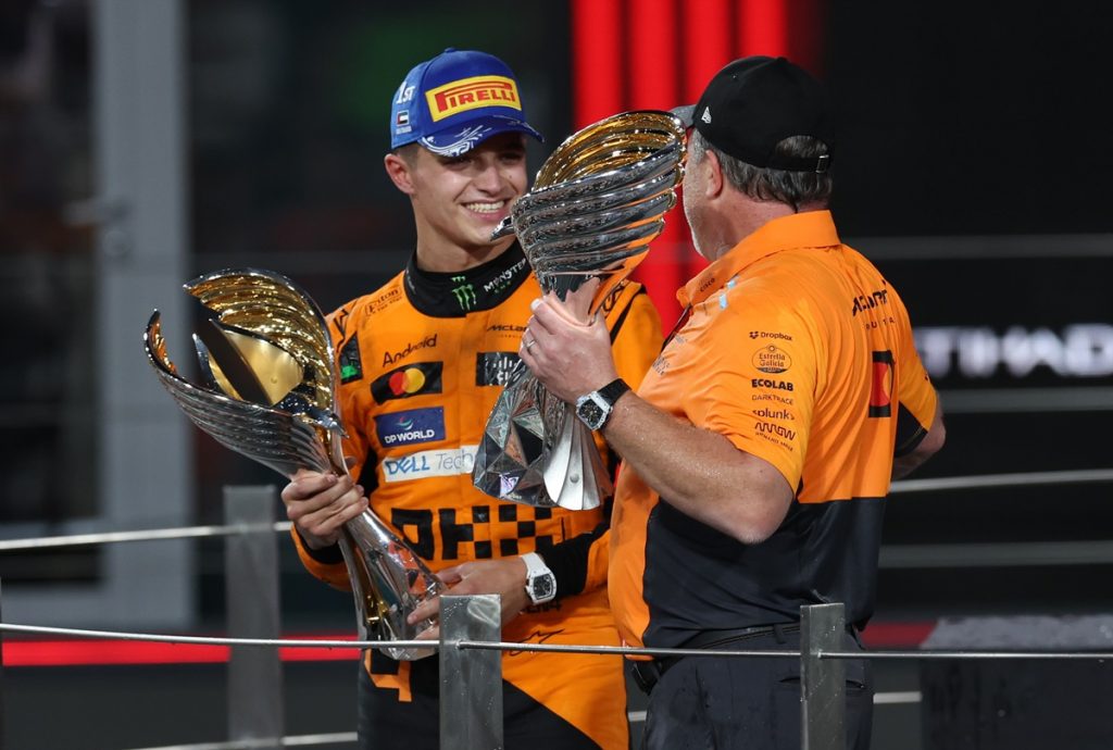 epa11764934 McLaren Racing CEO Zak Brown and his driver Lando Norris of Britain celebrate on the podium after the Formula One Abu Dhabi Grand Prix, at the Yas Marina Circuit racetrack in Abu Dhabi, United Arab Emirates, 08 December 2024. EPA/ALI HAIDER