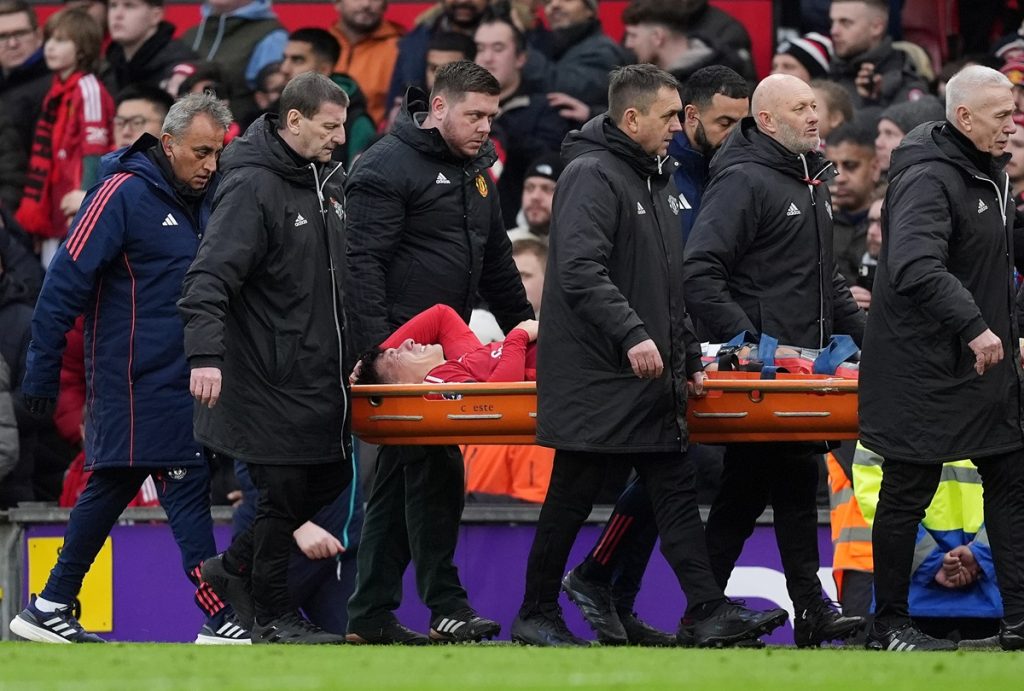 Manchester United's Lisandro Martinez leaves the pitch on a stretcher after going down injured during the Premier League match at Old Trafford, Manchester. Picture date: Sunday February 2, 2025.