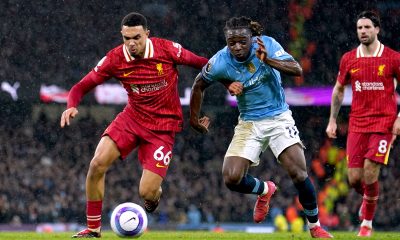 Liverpool's Trent Alexander-Arnold (left) battle for the ball with Manchester City's Jeremy Doku during the Premier League match at the Etihad Stadium, Manchester. Picture date: Sunday February 23, 2025.