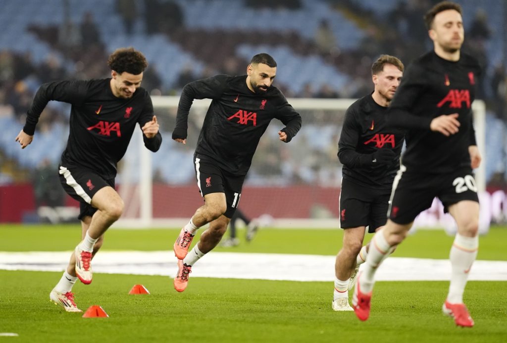 Liverpool's Mohamed Salah (centre) warms up ahead of the Premier League match at Villa Park, Birmingham. Picture date: Wednesday February 19, 2025.