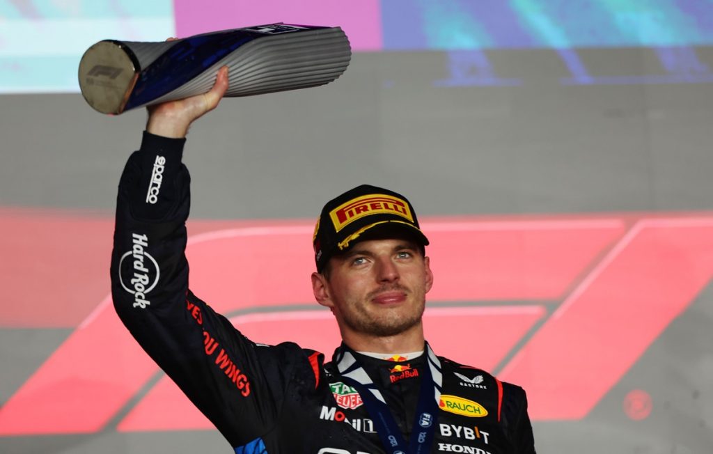 epa11752168 Red Bull Racing driver Max Verstappen of Netherlands celebrates with trophy on the podium after winning the Formula 1 Qatar Grand Prix at the Lusail International Circuit racetrack in Lusail, Qatar, 01 December 2024. EPA/ALI HAIDER