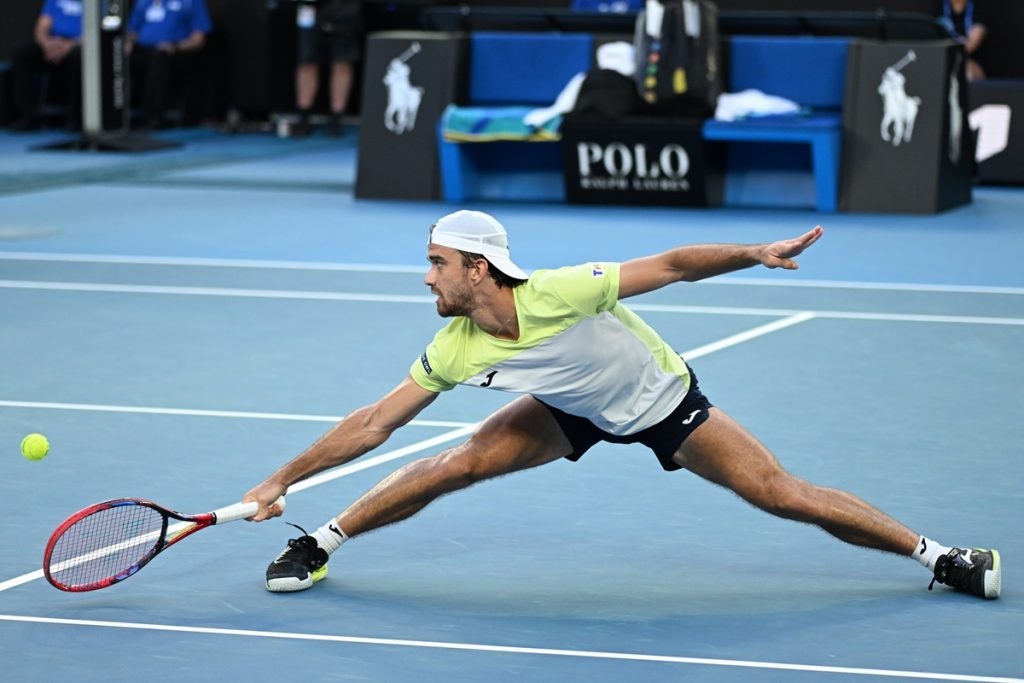 epa11830273 Tomas Machac of Czechia in action during the Men's Singles round 3 match against Novak Djokovic of Serbia at the Australian Open Grand Slam tennis tournament in Melbourne, Australia, 17 January 2025. EPA/JAMES ROSS AUSTRALIA AND NEW ZEALAND OUT