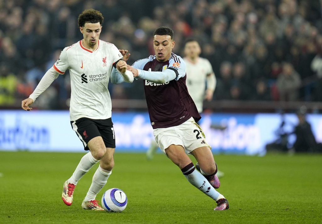 epa11908426 Morgan Rogers (R) of Aston Villa in action against Curtis Jones of Liverpool during the English Premier League match between Aston Villa and Liverpool FC, in Birmingham, Britain, 19 February 2025. EPA/TIM KEETON EDITORIAL USE ONLY. No use with unauthorized audio, video, data, fixture lists, club/league logos, 'live' services or NFTs. Online in-match use limited to 120 images, no video emulation. No use in betting, games or single club/league/player publications.