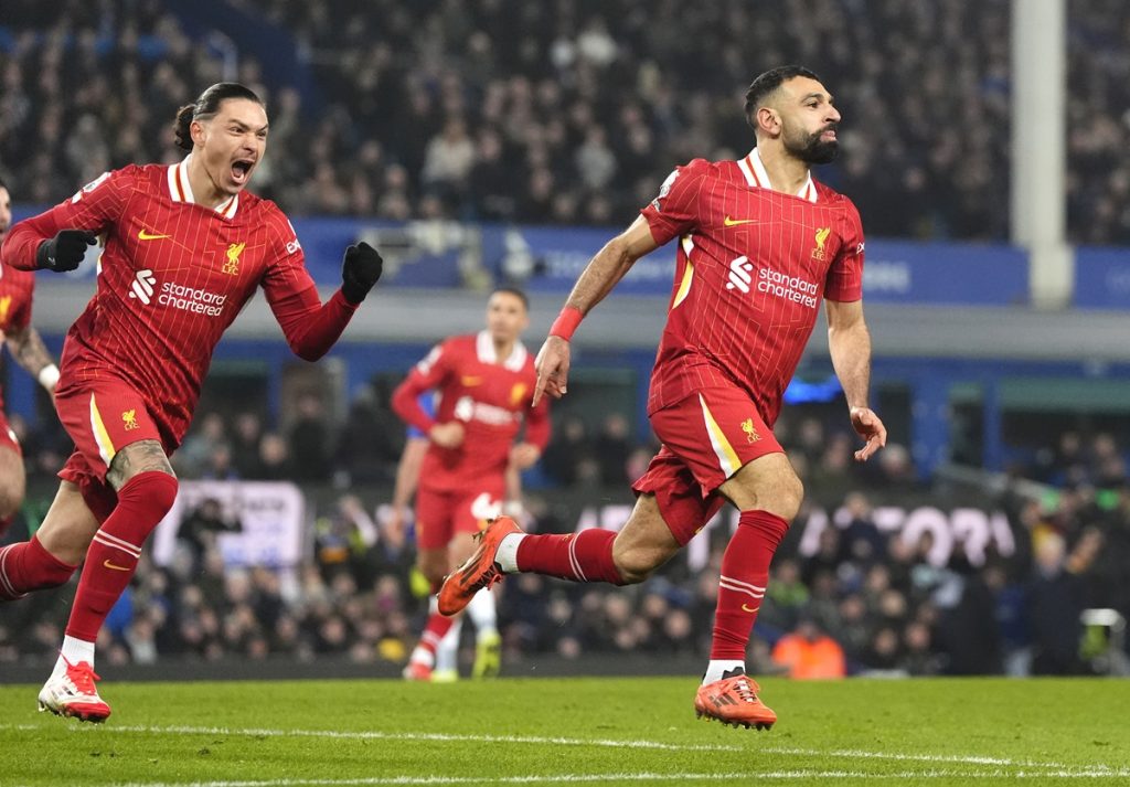 Liverpool's Mohamed Salah (right) celebrates scoring their side's second goal of the game with team-mates during the Premier League match at Goodison Park, Liverpool. Picture date: Wednesday February 12, 2025.