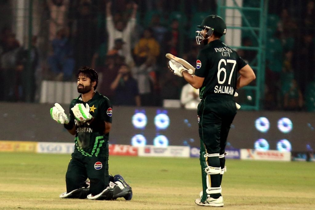 epa11891318 Mohammad Rizwan (L) of Pakistan celebrate a handrad runs during the 3rd one day international (ODI) cricket match against Pakistan at the National Stadium in Karachi, Pakistan, 12 February 2025. EPA/REHAN KHAN