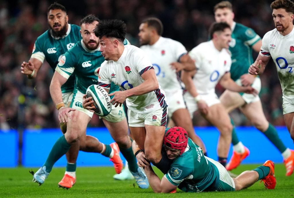 England's Marcus Smith tackled by Ireland's Josh van der Flier during the Guinness Men's Six Nations match at the Aviva Stadium in Dublin, Ireland. Picture date: Saturday February 1, 2025.