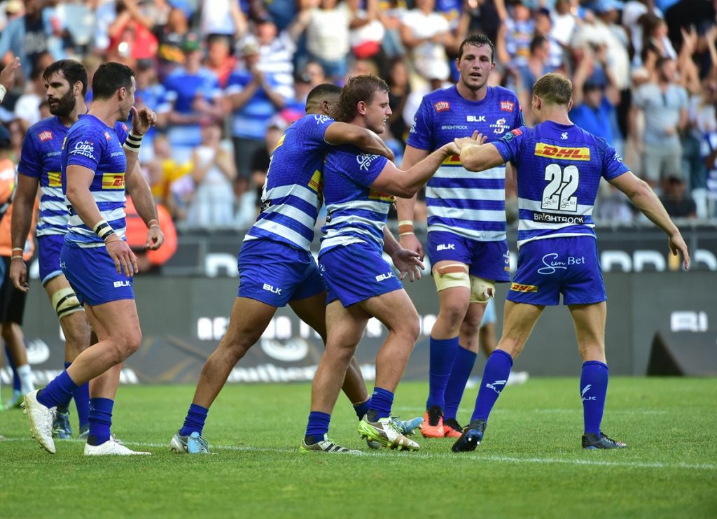 Jean-Luc du Plessis of DHL Stormers celebrates with fellow team mates after scoring a try during the United Rugby Championship 2024/25 game between the Stormers and Sharks at Cape Town Stadium in South Africa on 28 December 2024 © Reinhardt Hamman/BackpagePix